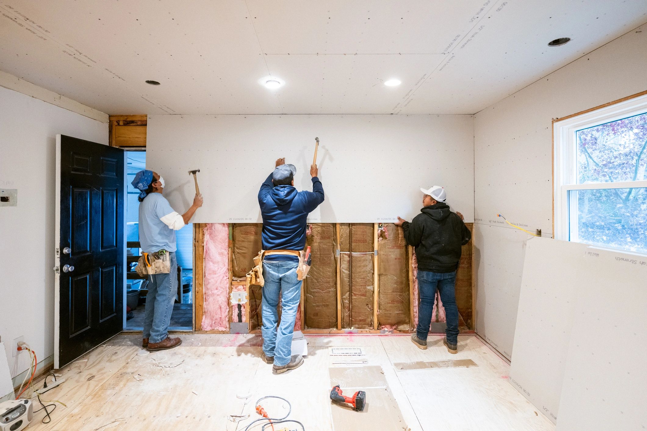 Renovation team working inside a home
