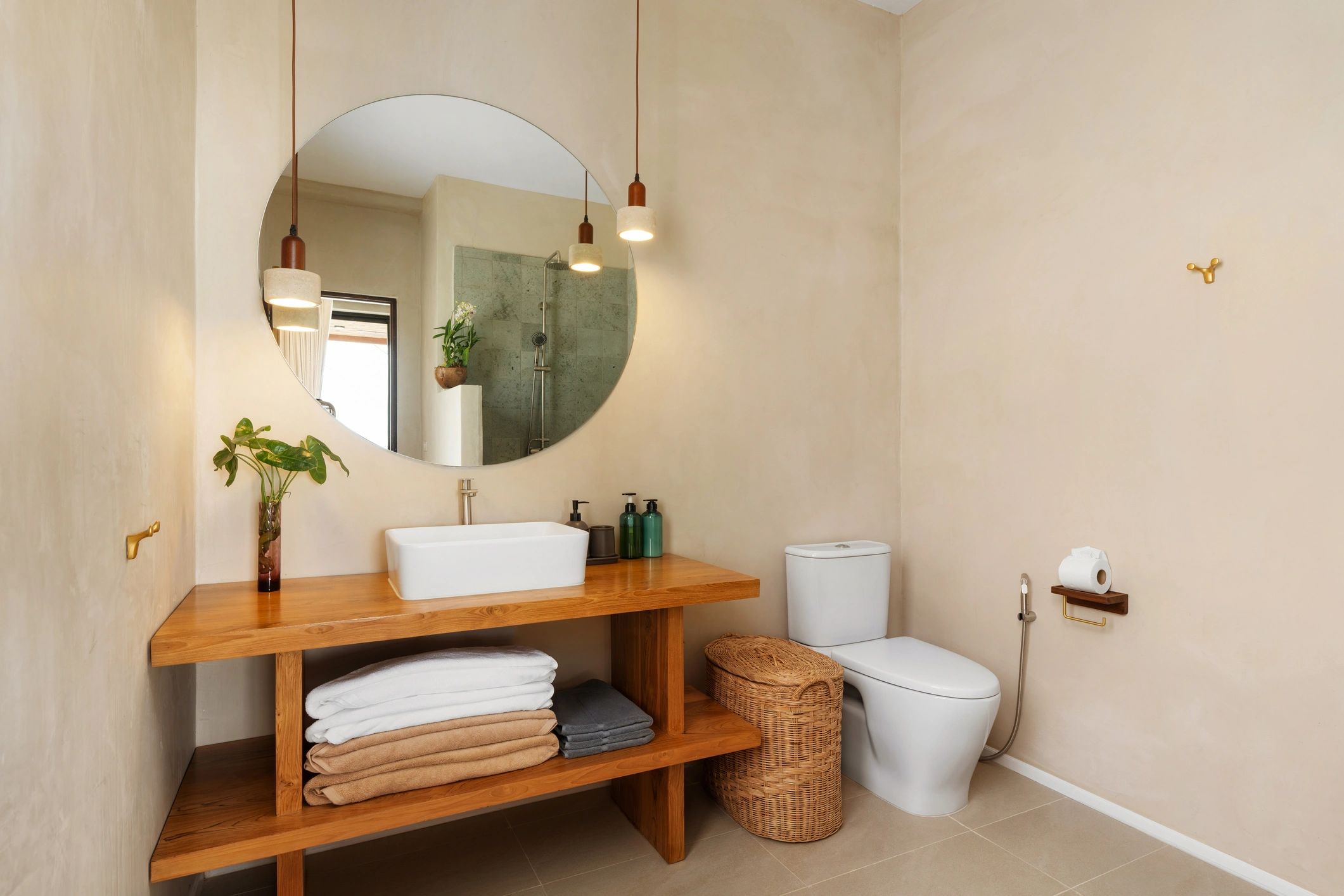 Minimal bathroom with wood vanity and neutral finishes