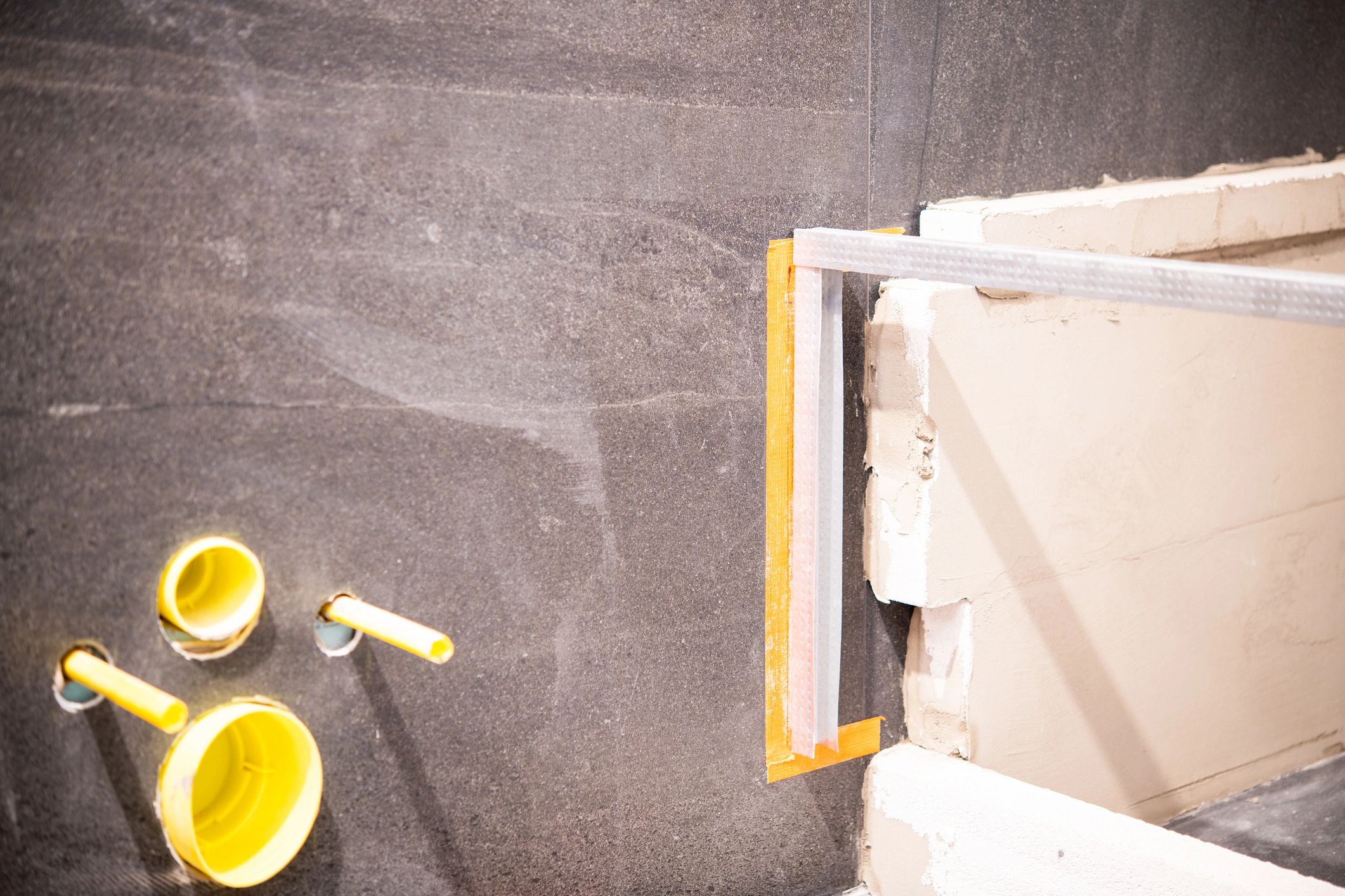 Bathroom renovation detail with plumbing and framing